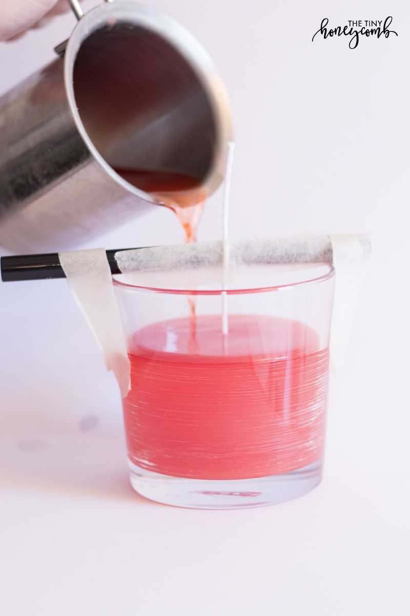 Pour your melted candle wax into your glass jar